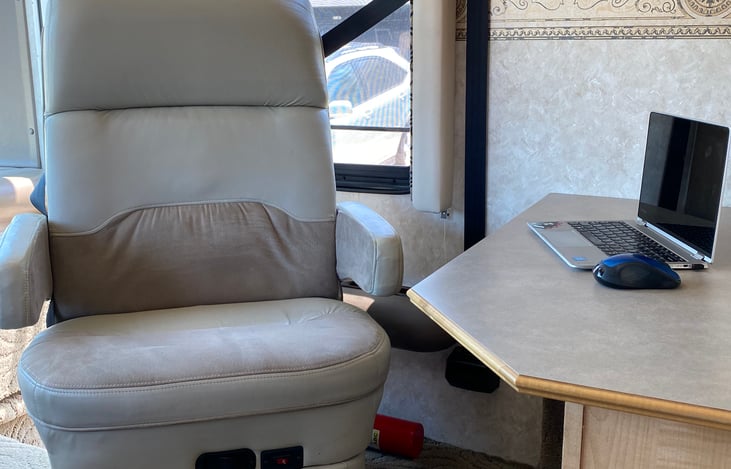 Passenger seat turns to desk area