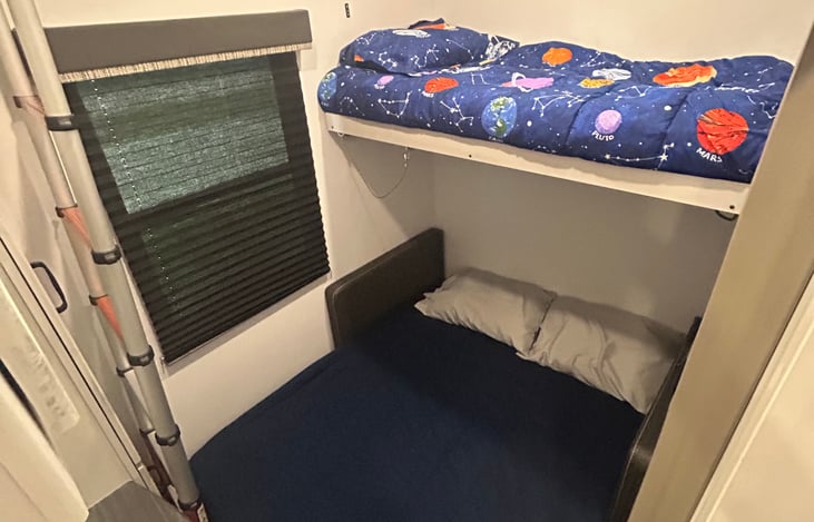 Twin bunk with full sleeper configuration.