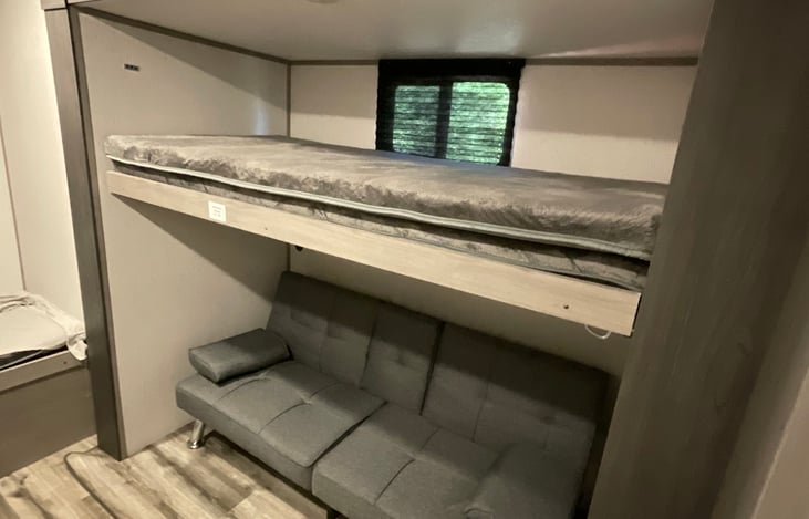 Right side bunk. Max weight for top is 150lbs. There is an extra bunk mattress if someone would like as a possible 10th person (for floor)