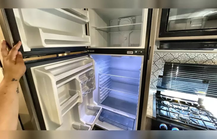 Interior:  refrigerator, stove and microwave.
