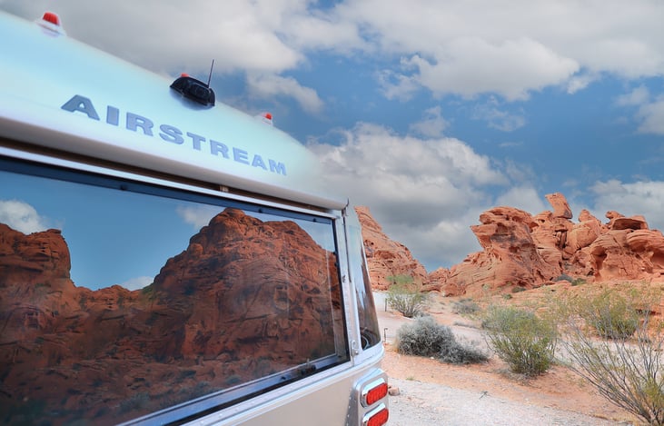 Front, rear, and side windows open.