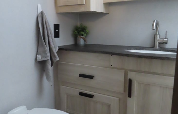 Bathroom includes hand towel hook.