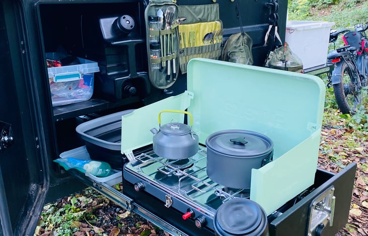 Two burner camp stove with basin you can use as a sink to wash dishes. We also provide a sponge and dish soap.