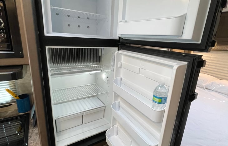 Refrigerator and freezer so you can bring your favorite foods, snacks, and drinks. Refridgerator and oven run off propane.