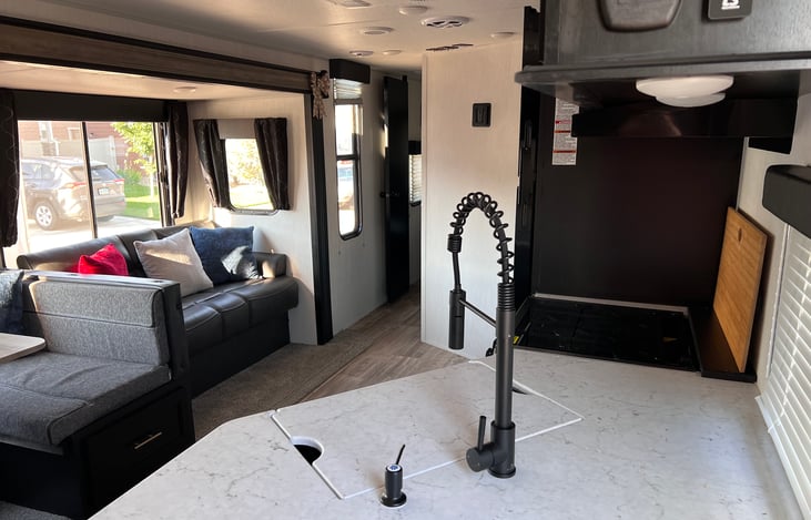 View of kitchen and living when you first enter