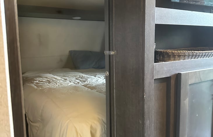 Queen size master bedroom that closes off from the rest of the trailer