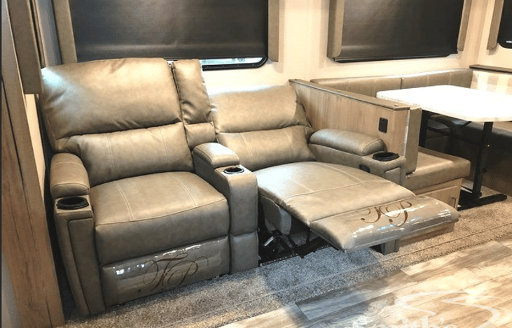 2 recliners in kitchen area.  Has drink holders & lights underneath.