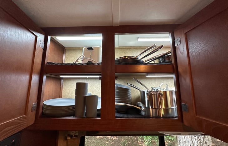 Over the dinette cabinets with kitchen utensils