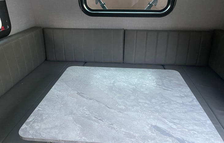 Really nice dining area with table that can be adjusted for converting to queen size bed.