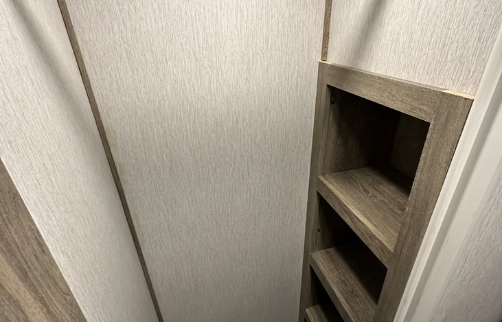 Master bedrooms main closet with shoe rack/ extra storage.