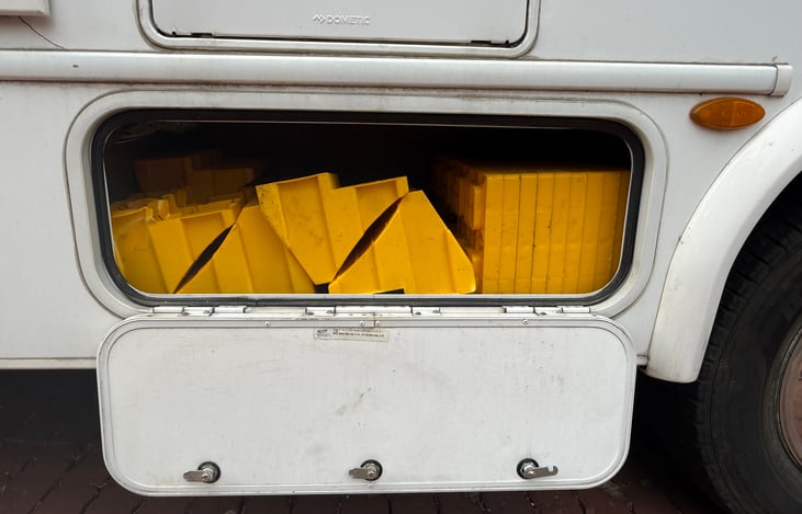 Second drivers side compartment carrying rear levelers.
