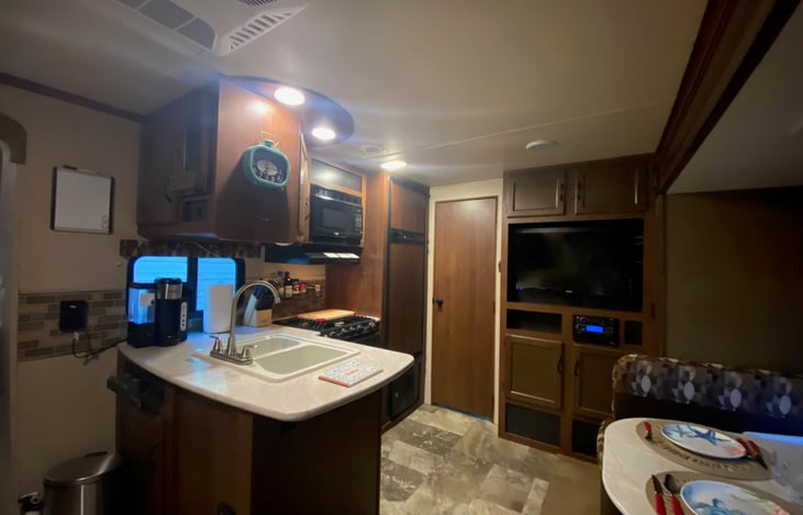 Kitchen, Dining,  and Entertainment Center.