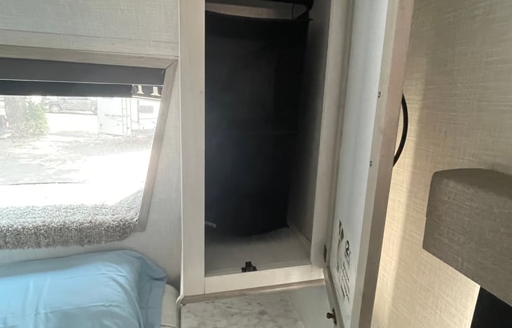 Right side of bed closet and hanging organizer.