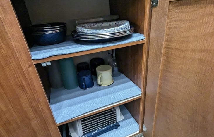 Stocked with plates, cups, coffee mugs, water cups, silverware, cookware etc