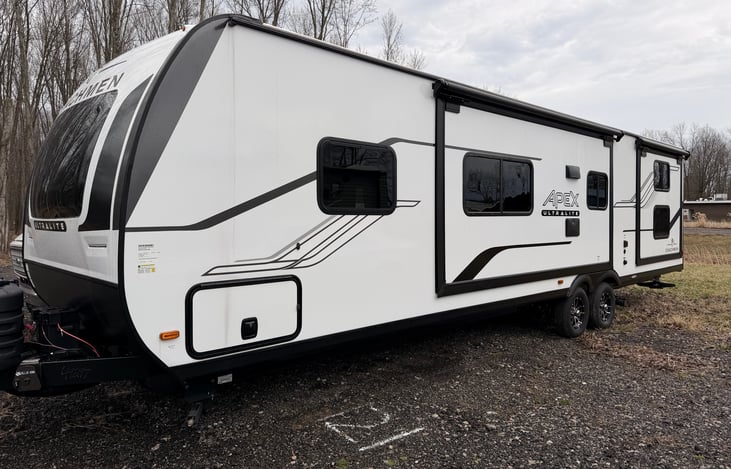 Pass through storage up front and full living space slide and bunkhouse slide. 50 amp service for both ACs in this camper.