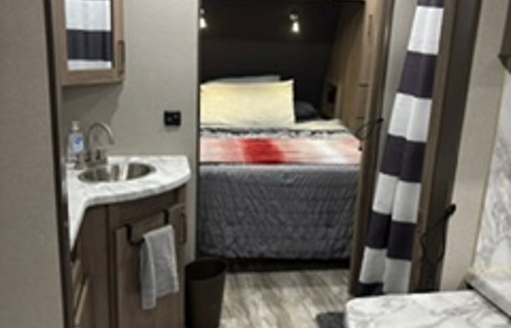 Bathroom is private with two heavy doors. Towels and washcloths along with travel size toiletries are provided. We also provide RV toilet paper.