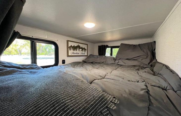 Top bunk with 2 windows and USB charger