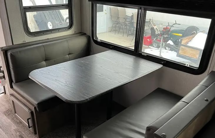 Dinette seats four, and also converts to a full size bed.  Sheets and pillows provided.