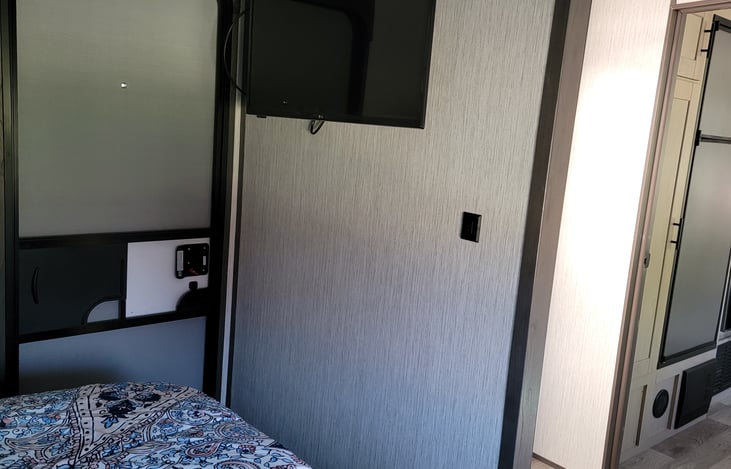 Master bedroom exterior door and mounted TV