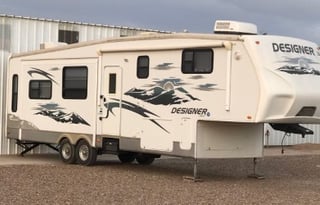 A 5th wheel travel trailer suited for 2 people