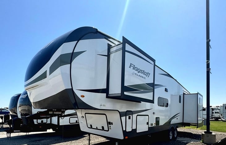 Tons of exterior storage. 3 Slides. Out door kitchen area, and awnings for grilling out or tailgating.