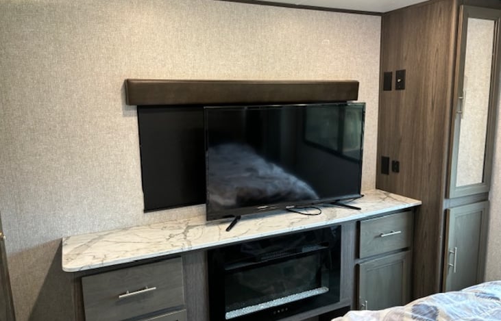 Bedroom tv and fireplace