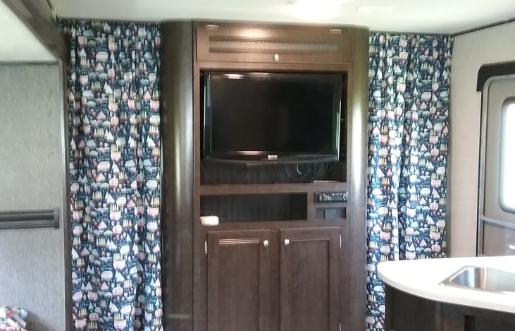 Privacy curtains for main bedroom.  TV, stereo and more charging ports.