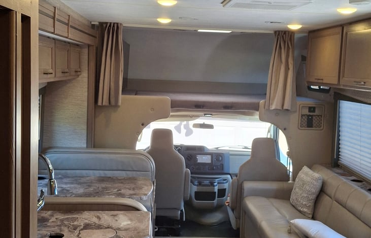 Bed above driver seat.