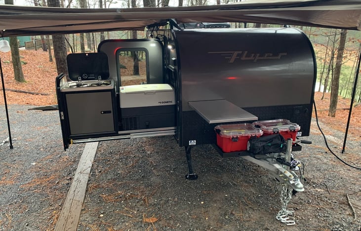 View of the kitchen setup, dual burner stove, and Dometic freezer/fridge