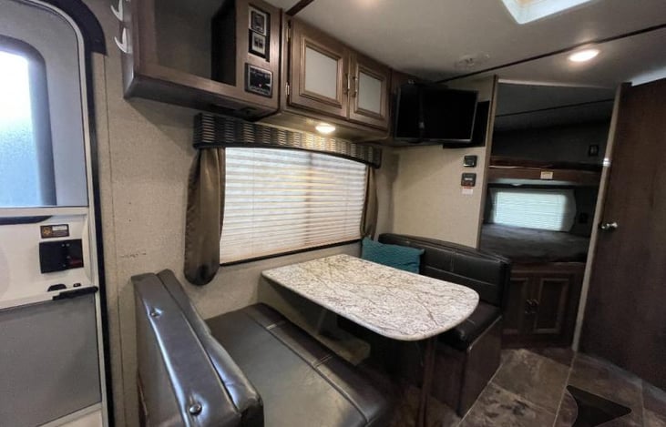 Dining booth that can be converted to a bed.