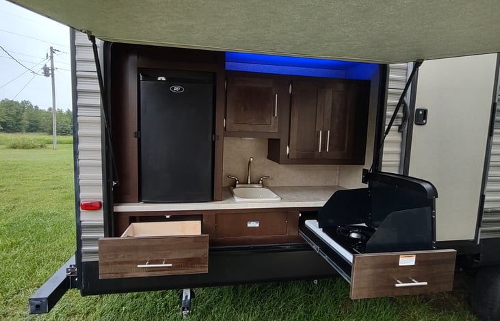 Outdoor kitchen with fridge and 2 burner gas stove