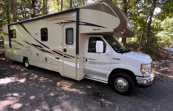 20 foot long awning to protect you from the elements.
 A 10 foot rug in the back with two 0 gravity loungers, a Coleman gas grill, Blackstone table top griddle, and a 6 foot table.