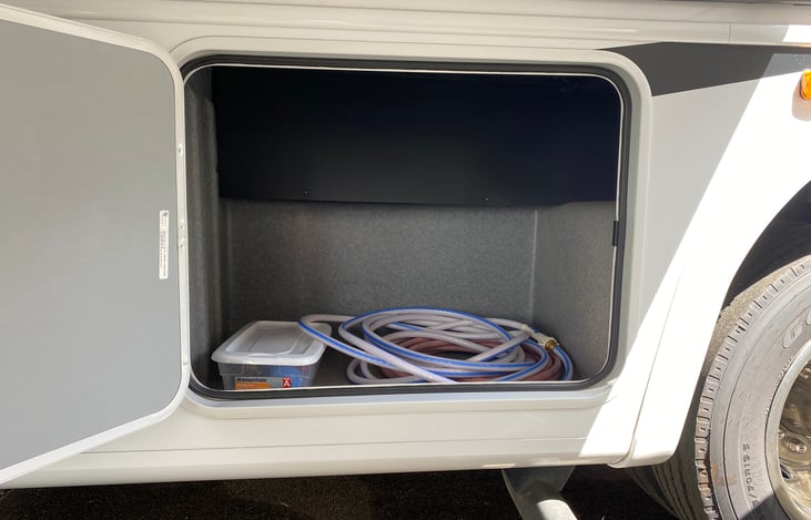 extra large compartment! We have the fresh water hose and filter.