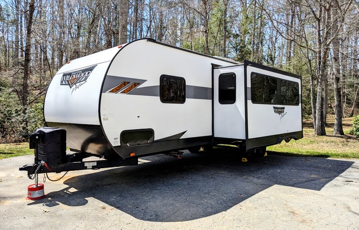 2023 Wildwood Platinum: Luxury family-ready rig with a King Master, double bunks, and Versa-Lounge. Enjoy the fireplace, bright modern interior, panoramic windows, outdoor kitchen large awning and mor
