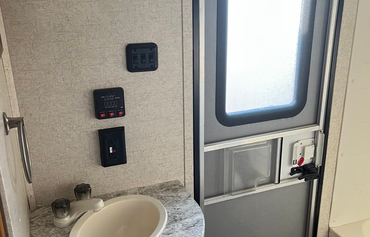 Bathroom has its own door directly to the outside so you don't have to walk through the camper to get to it.