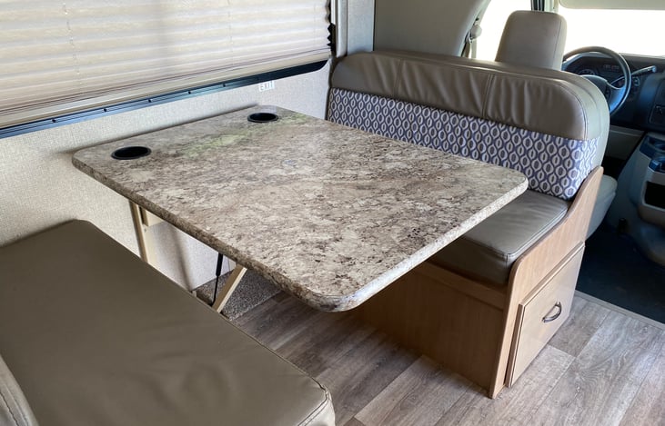 Dining table seats 4, also folds down to a single bed