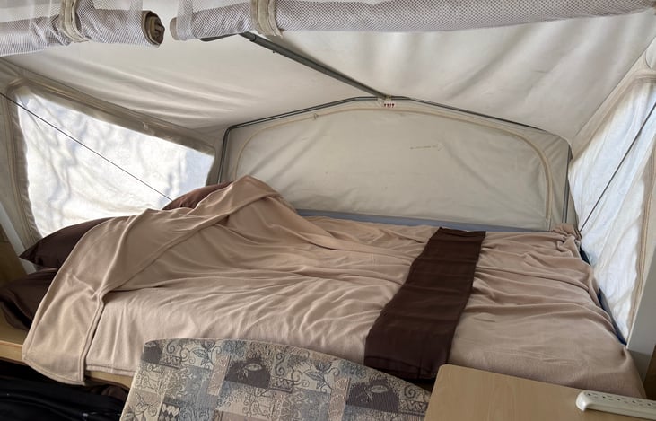 Comfortable spacious queen bed with bedding