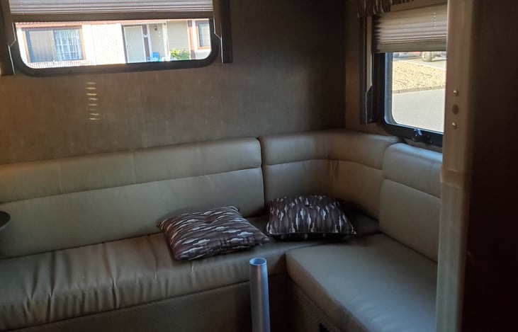 This sleeps 2, the slide out sleeps 2 and the the front by the top of drivers side sleeps another 2.  But comfortably 5 total.