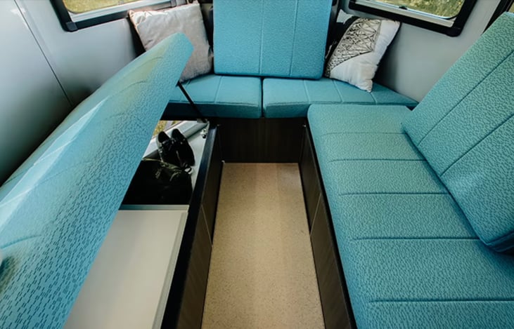 Rear seats with table (not shown), twin beds, or oversized king bed - with storage underneath.