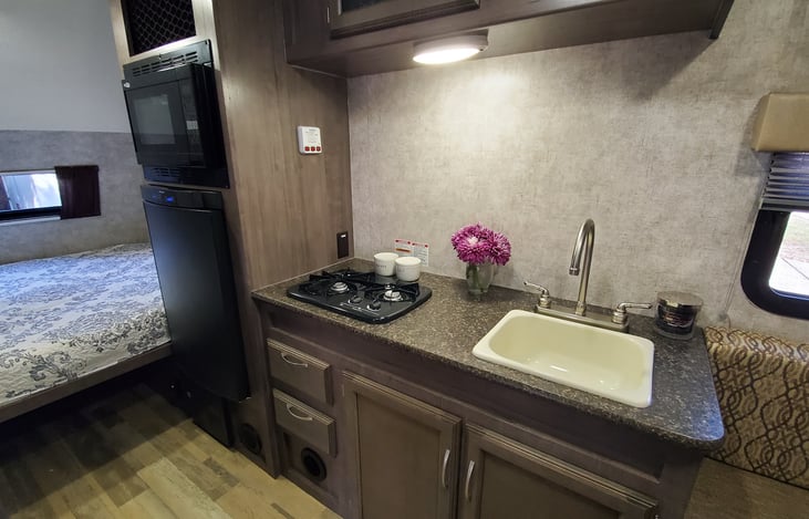 2 burner propane stove, and plenty of counter space for food prep.