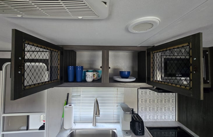 More storage/cabinet space above sink