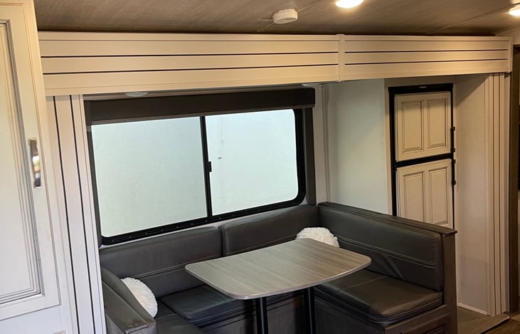 Pantry to the left, dinette that turns into a full size bed, Mid size fridge