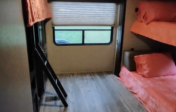 bunk house with fold up twin bunk over cube couch