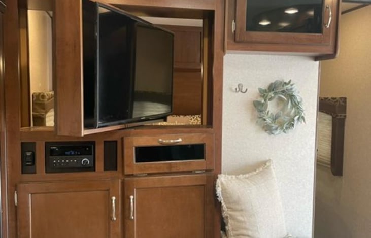 TV turns to master bedroom and kitchen area