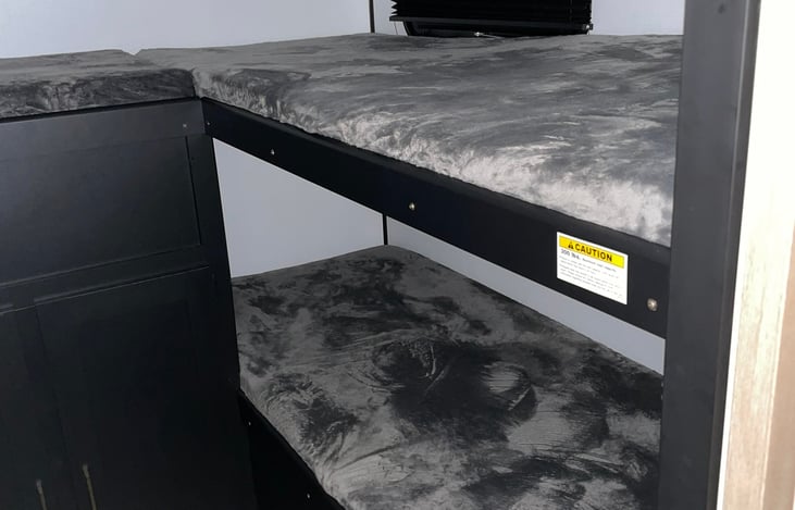 The bunkhouse pictured here is at the rear of the RV.