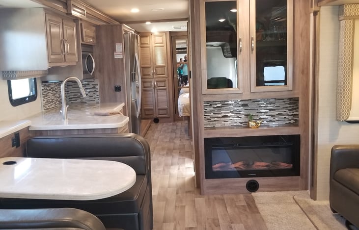 Dinning area with televator, and fireplace.