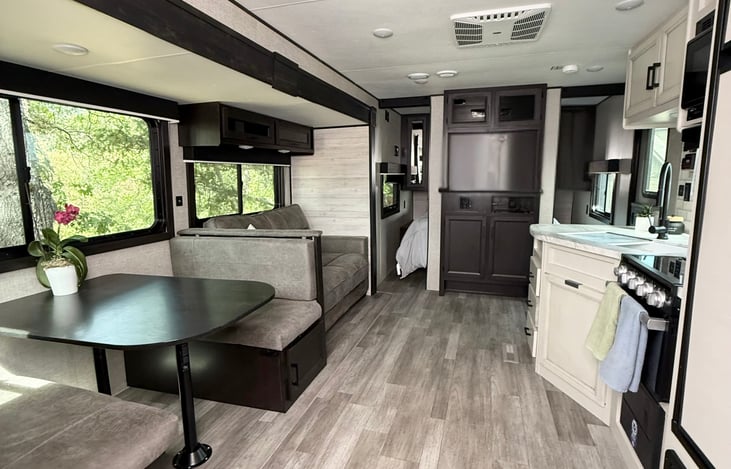 Dinette and sofa slide out making this living space extra large and inviting.