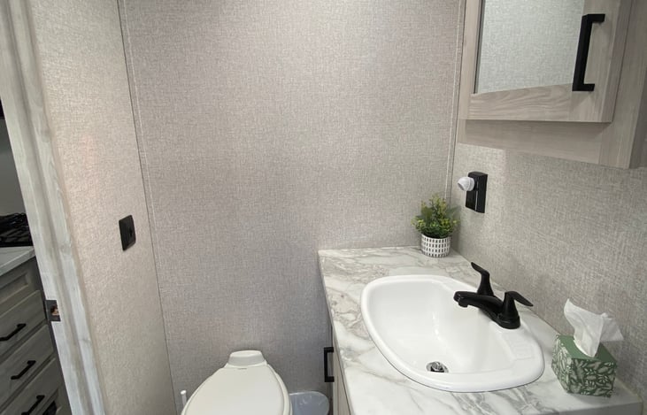 Plenty of counter and cabinet space in the bathroom.