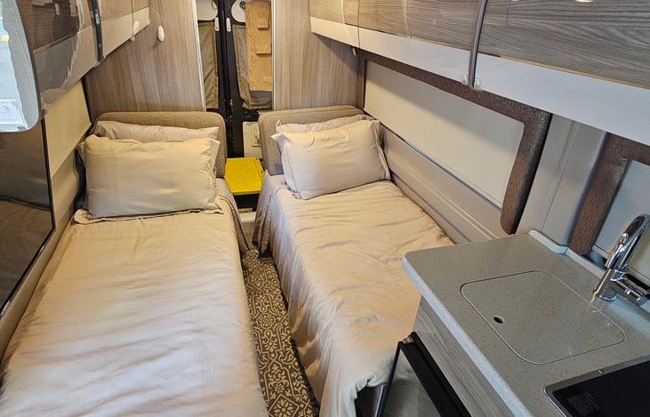 Twin bed sleeping arrangement.