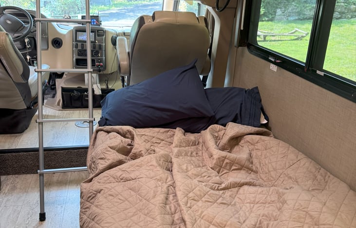 Couch before it was made up after sleep over.